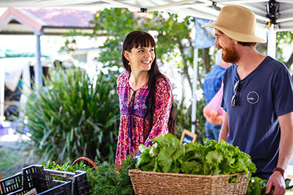 Couple buying vegetables at Ballina Farmers Market 