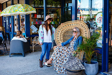 Ladies relaxing out front a shop in Lennox CBD