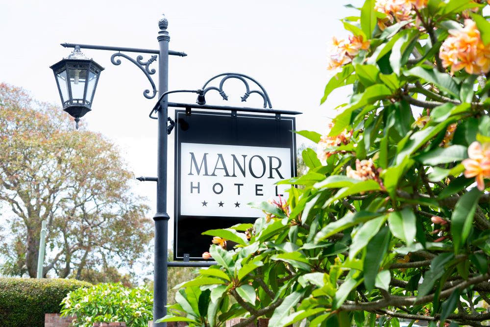 Ballina Manor sign and frangipani tree RS
