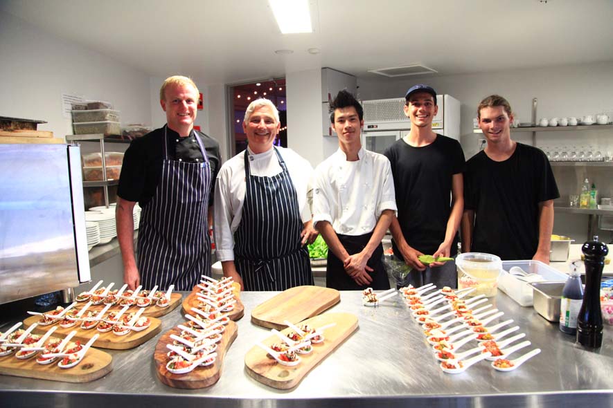 Caterers lined up behind canapes