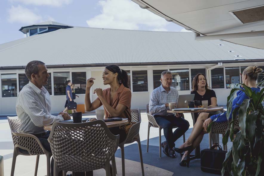 Delegates workshopping outside at tables