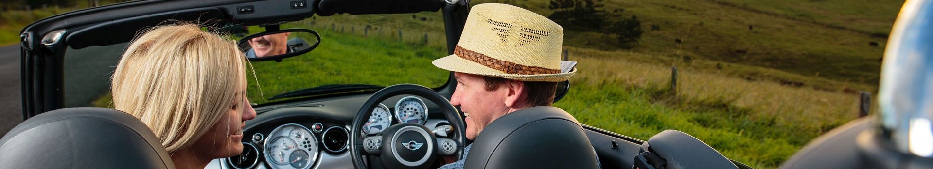 Couple looking at each other in convertible