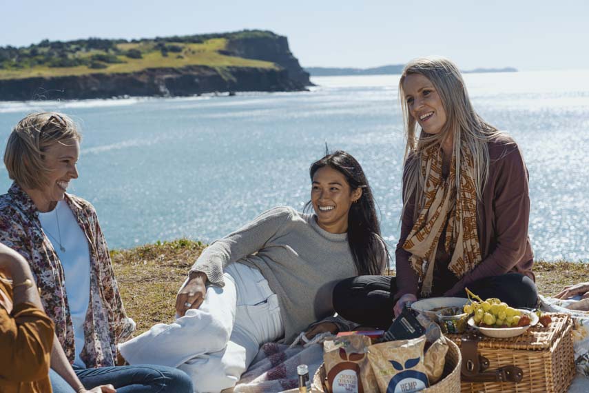 Boulders Beach Ballina Lennox Head 3 ladies sitting on headland with beach views