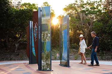 Couple looking at information signs