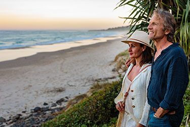 Couple enjoying the dusk sunset at beach