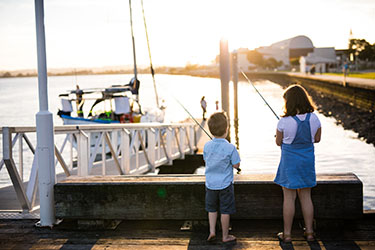 Kids fishing off Lance Ferris Wharf 