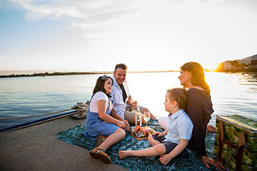 Family relaxing at Lance Ferris Wharf 