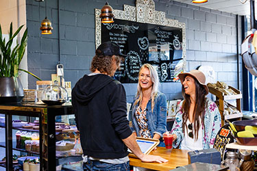 Ladies being served at cafe in Lennox Head