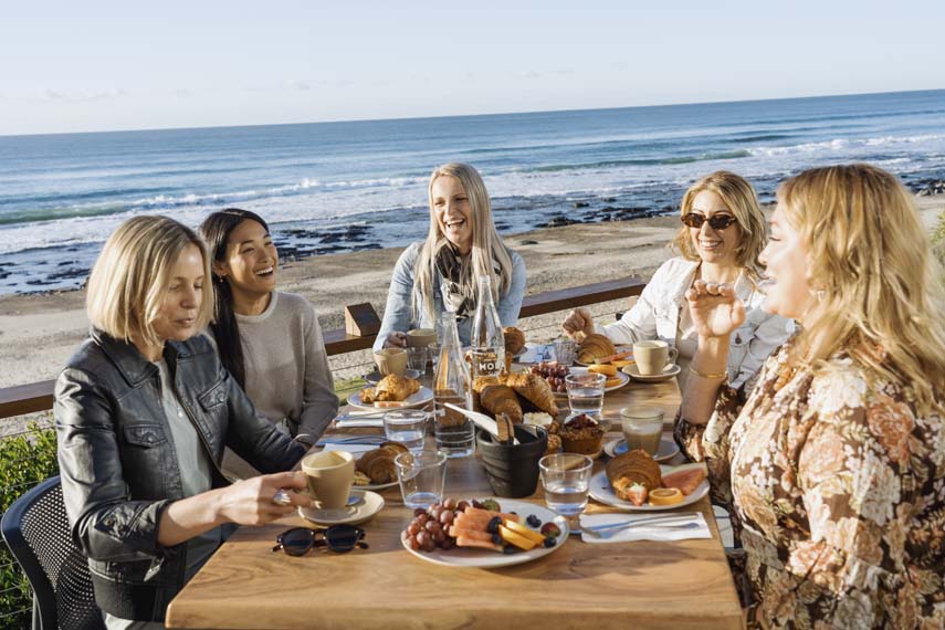 Waterfront Dining 2 Shelly Beach Cafe Ladies Eating with beach backdrop