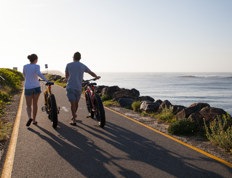 Walking bikes along breakwall