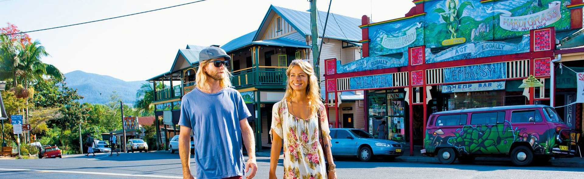 Couple walking through Nimbin street